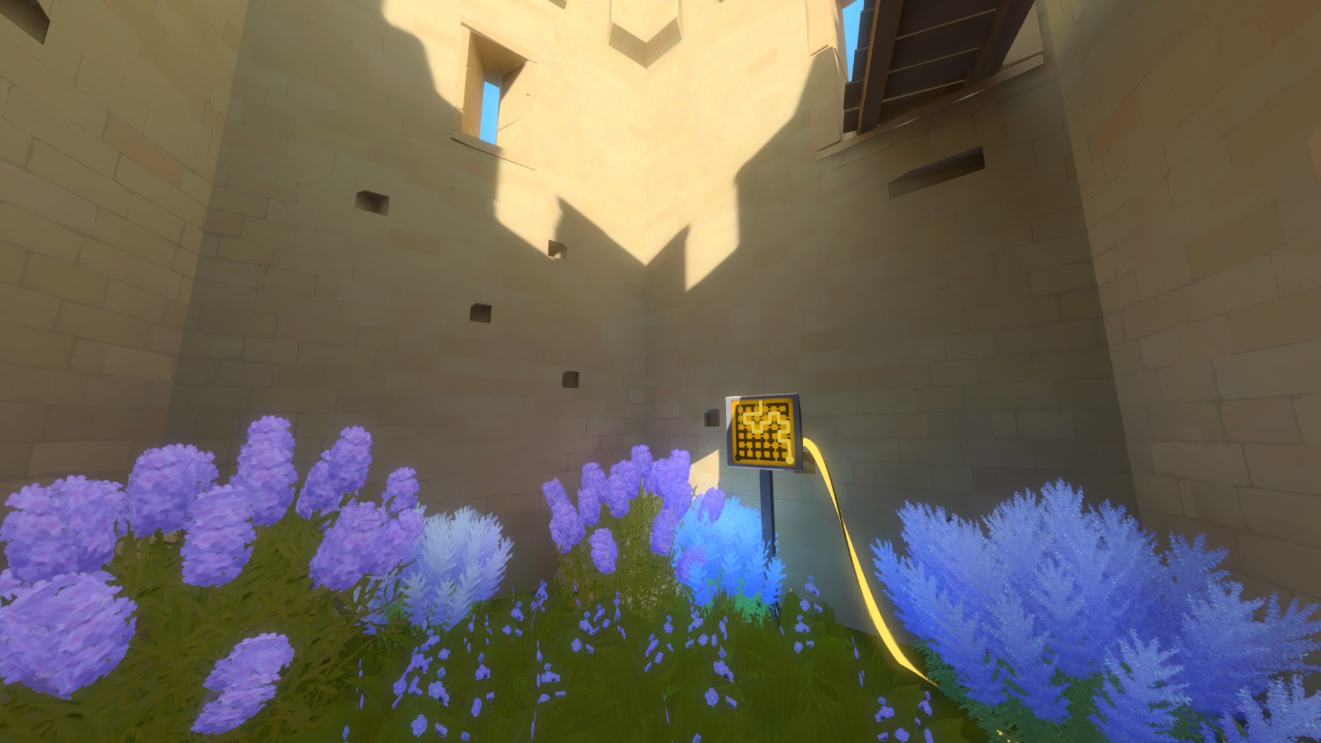 One of the tower interiors within Castle. Blue flowers bloom beside a solved panel.