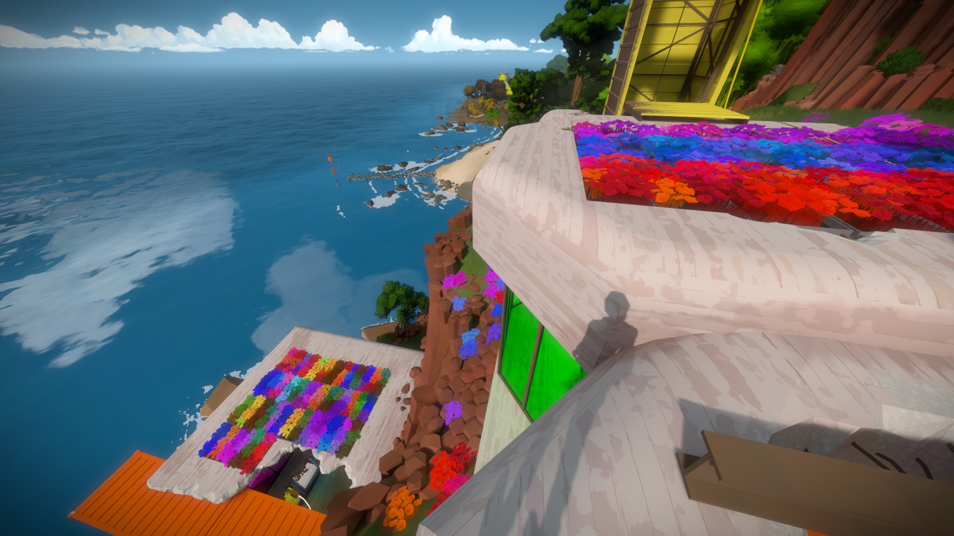 The top of Color Lab features colored rows of flowers. These rows extend to the rocky path below.